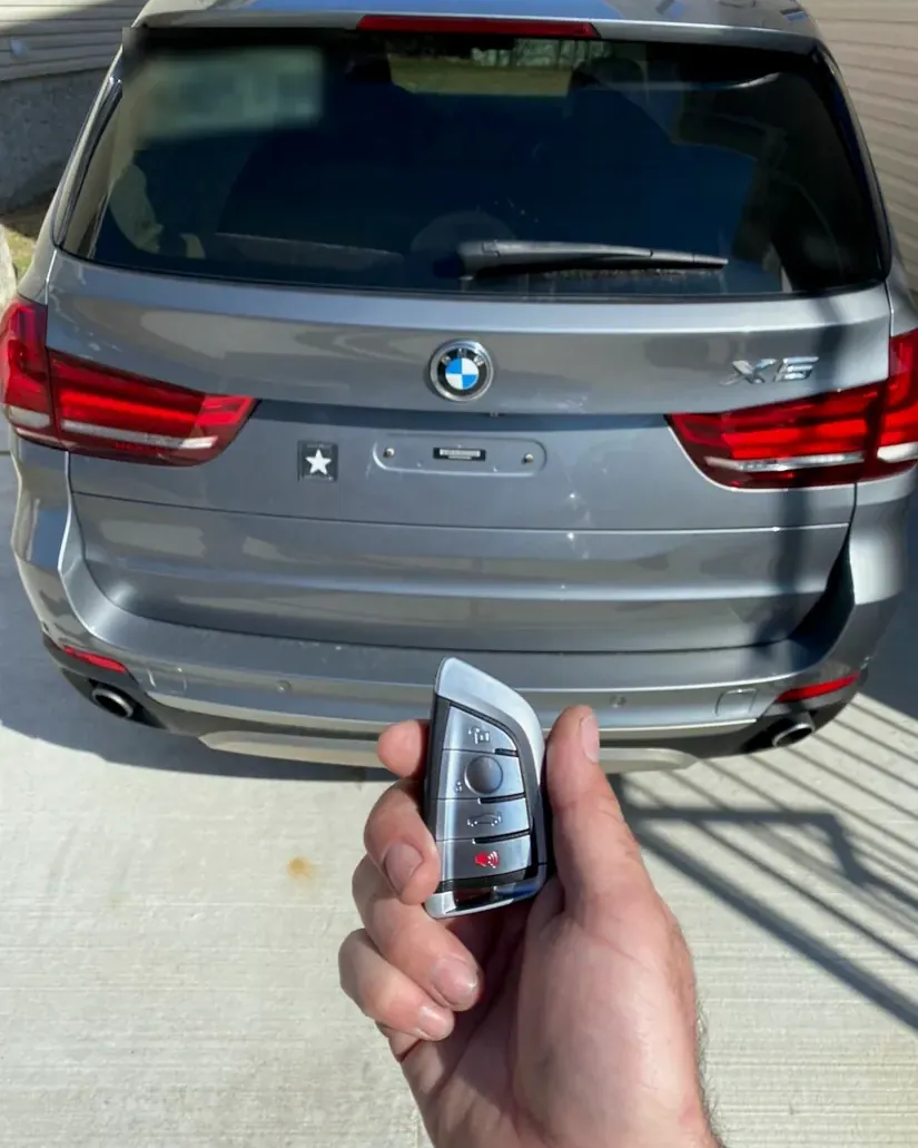 New BMW X5 smart key held in front of the car by a Valley Stream locksmith