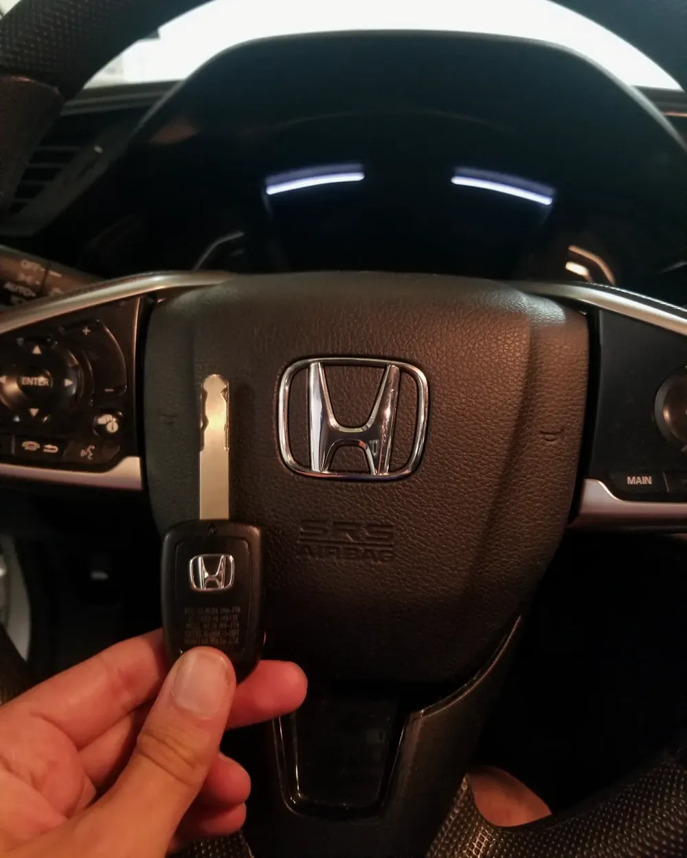 New Honda remote key held at the steering wheel after a job in Hewlett, NY