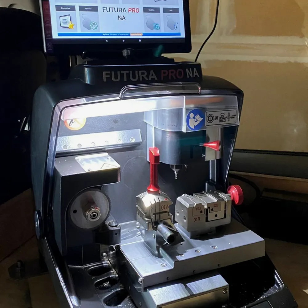 Computerized key cutting machine in a mobile locksmith van