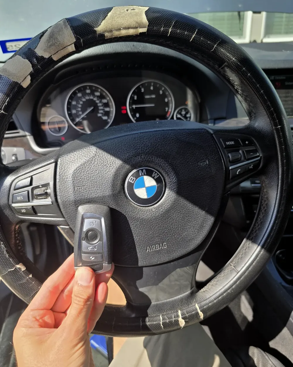 New BMW key at the steering wheel