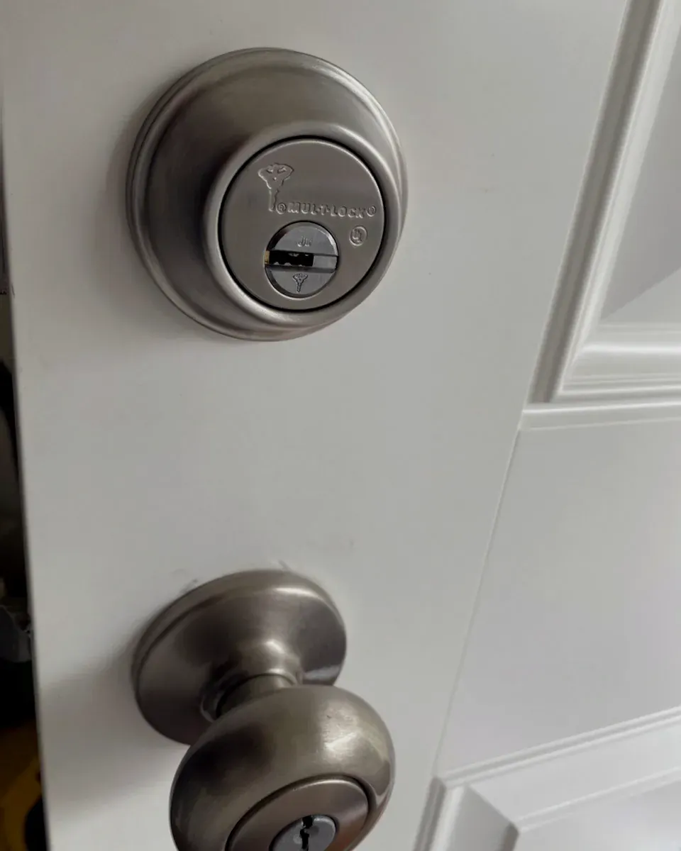High-security deadbolt above a knob lock on a home door